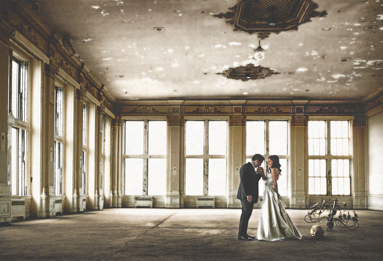 Couple in a derelict ballroom