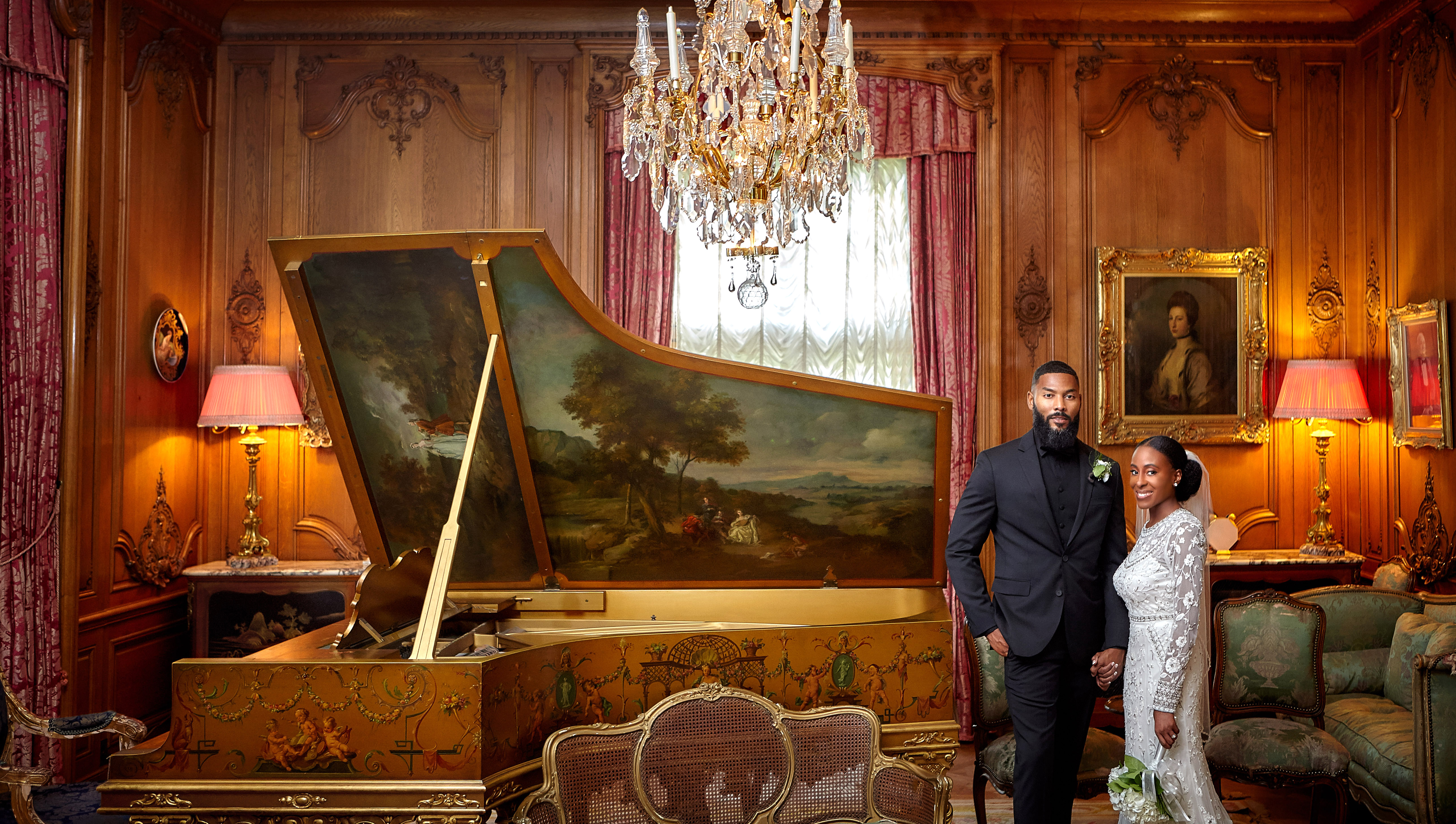 Couple beside a painted harpsichord
