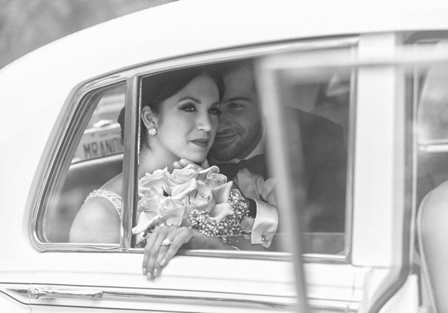 Couple framed in a car window